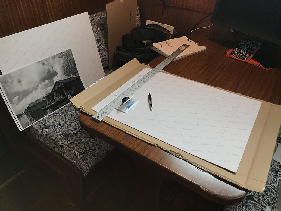 Photo Mat Being Measured and Cut in Boat Dinette.